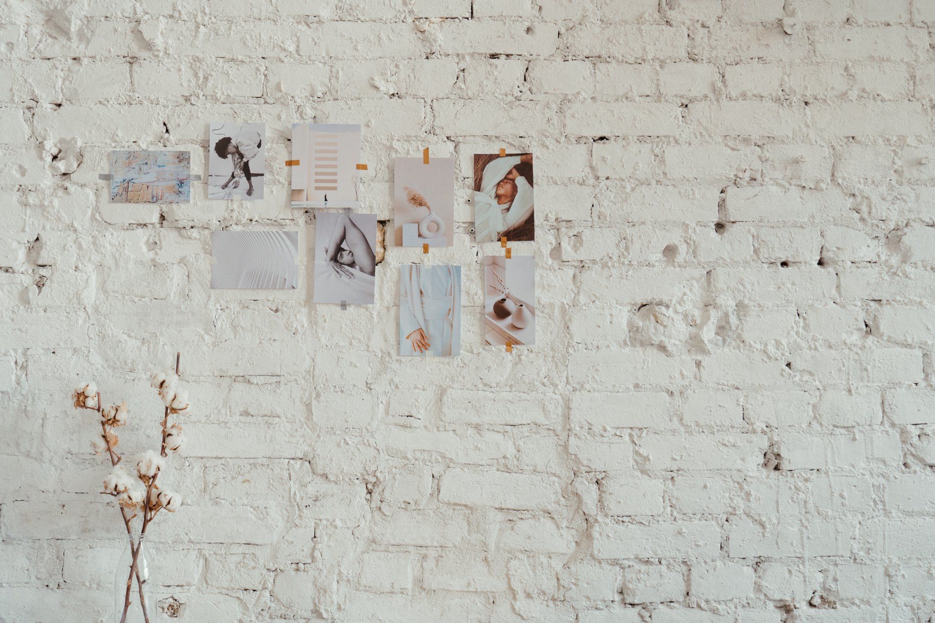 GK Marketing Online | A white brick wall with a vase of flowers on it.
