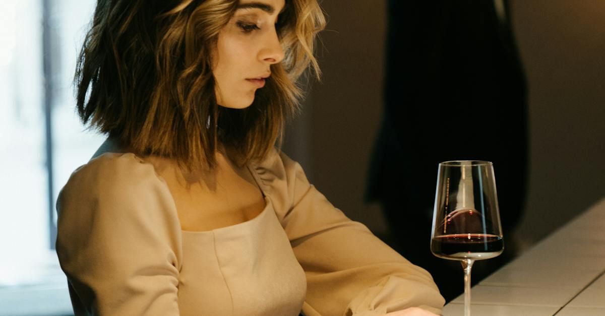 a row of wine glasses are lined up on a table .