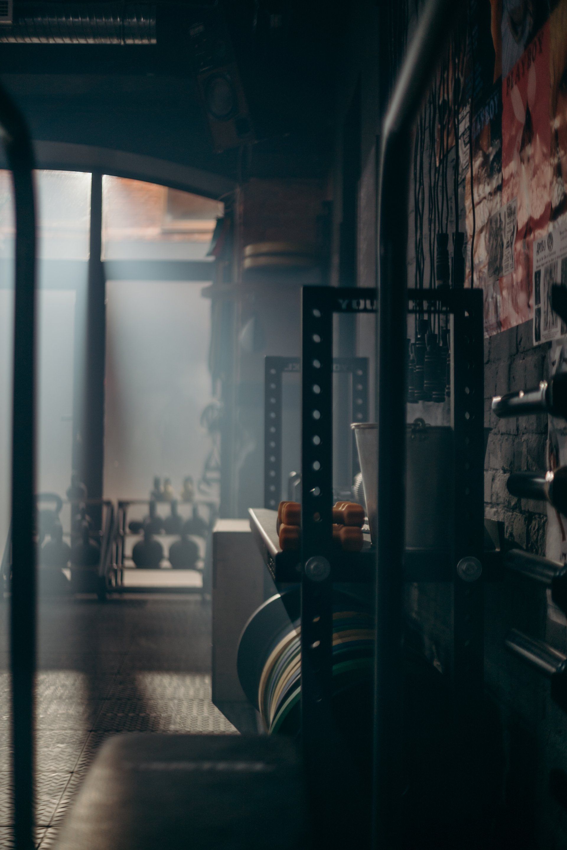 A dark room with a lot of smoke coming out of the window.