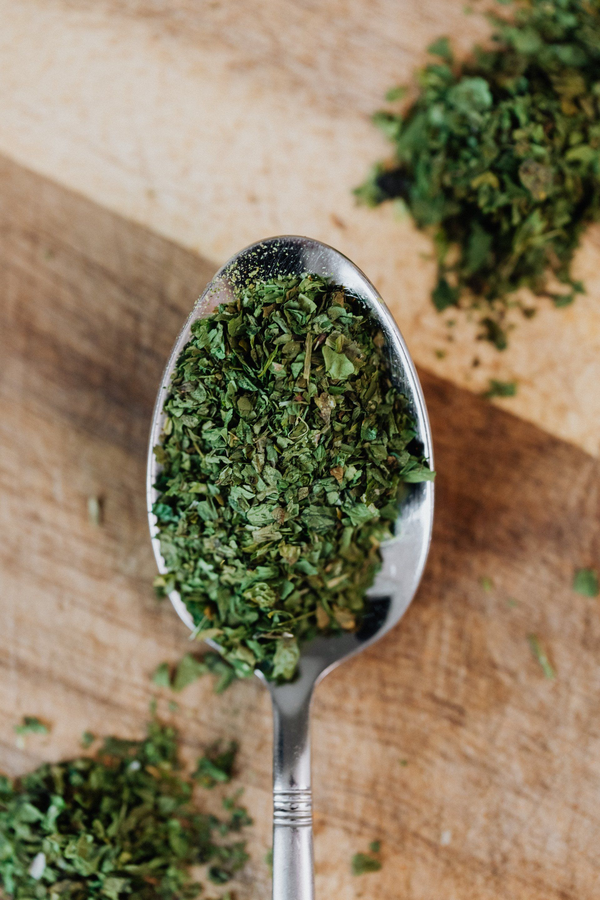 a close up of a bunch of oregano leaves on a plant .