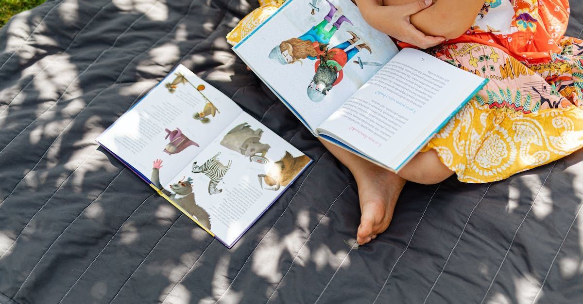 A girl reading two books