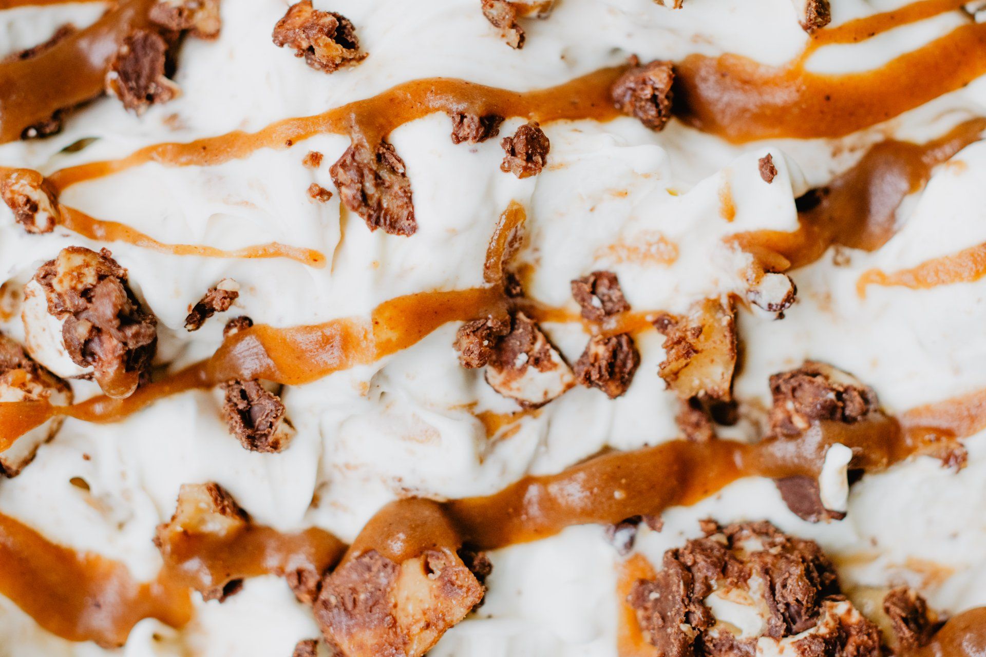 Vanilla ice cream topped with caramel drizzle and crumbled cookie pieces. Grasshopper Farms Knightdale, NC