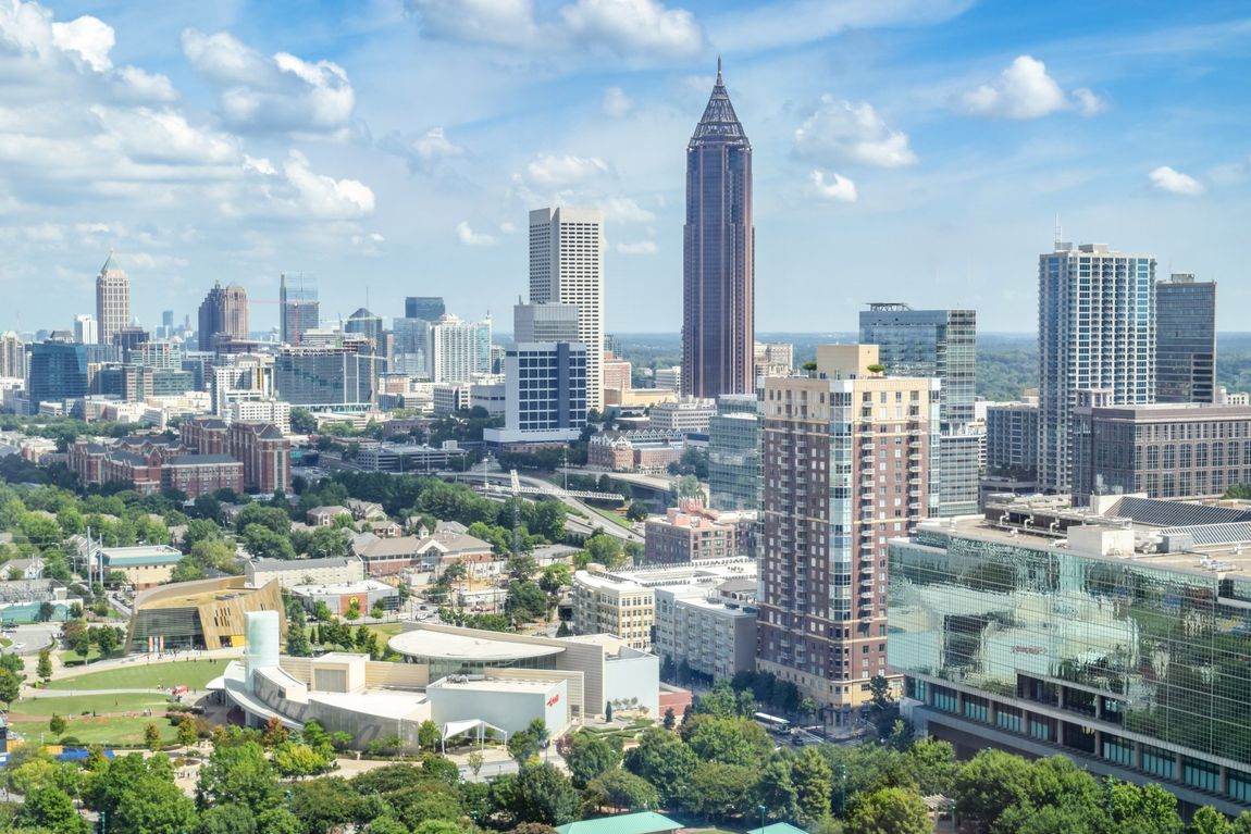 An aerial view of a city with a lot of buildings and trees.
