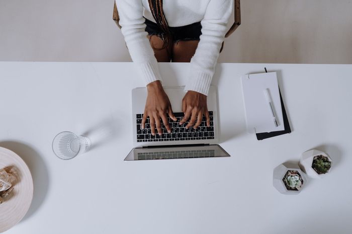 Person looking up stats on computer