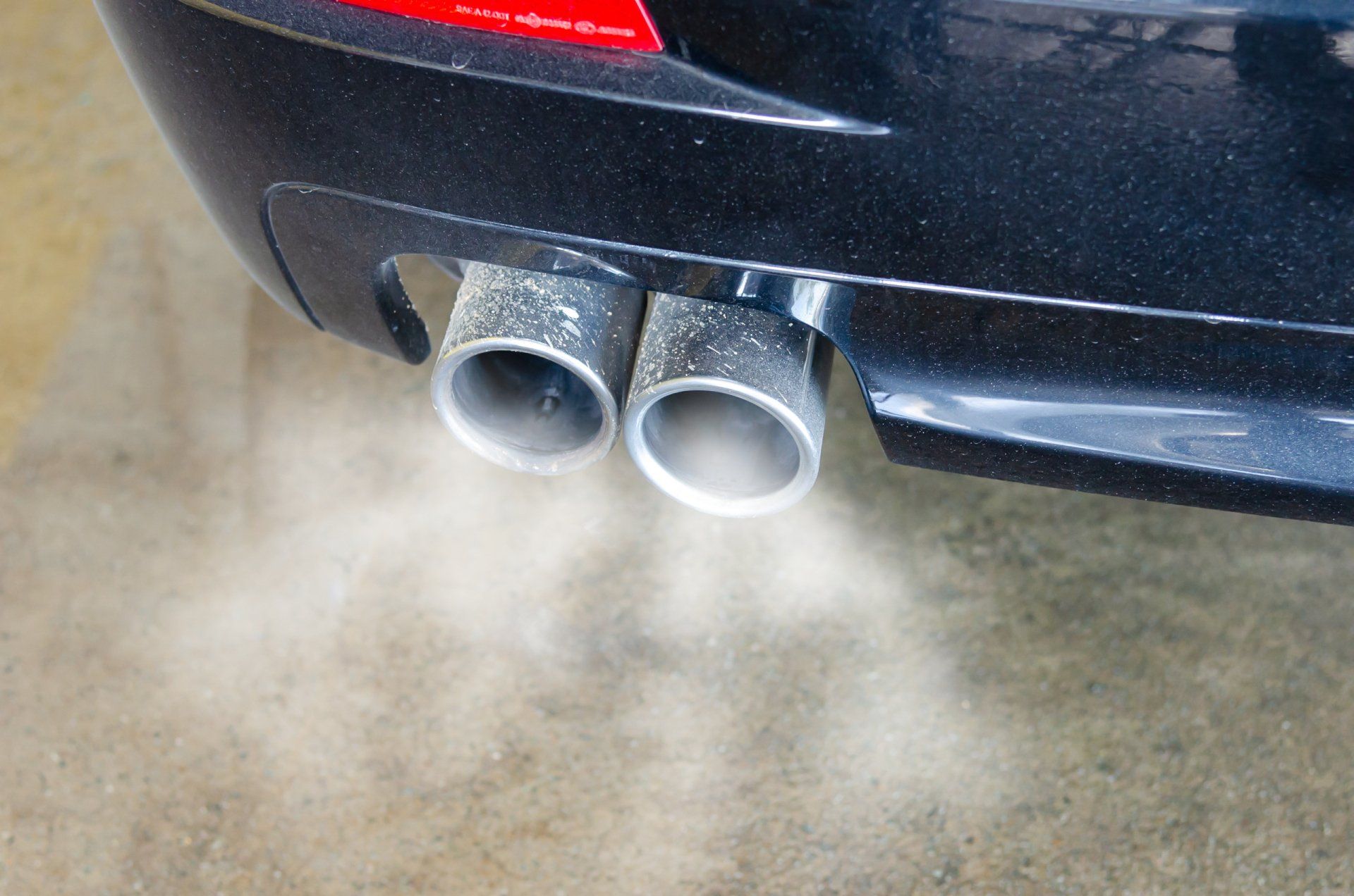 A car spewing exhaust