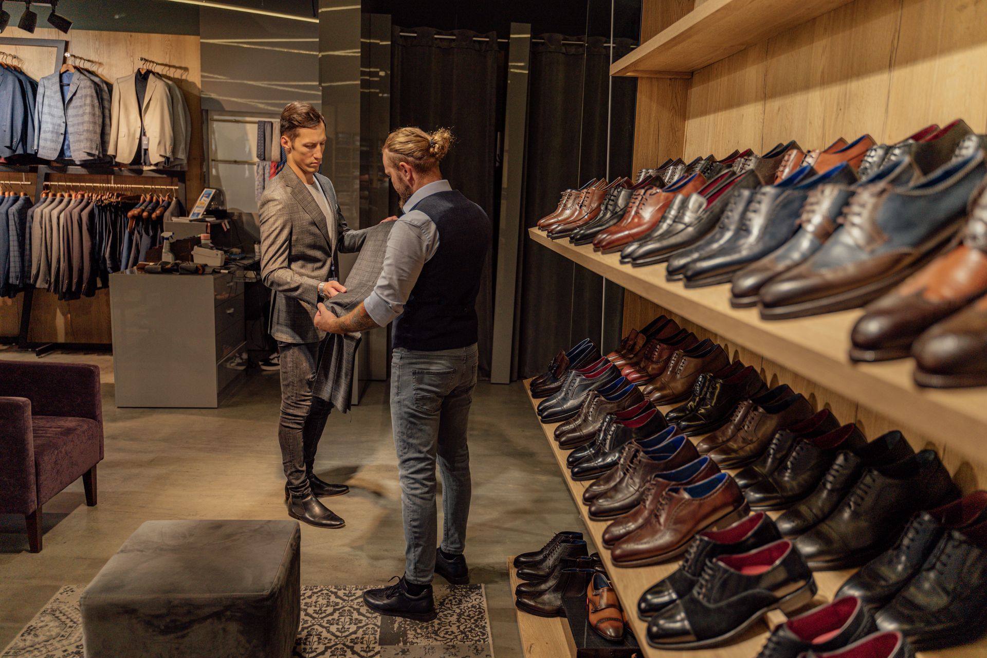 Man being assisted in a clothing store