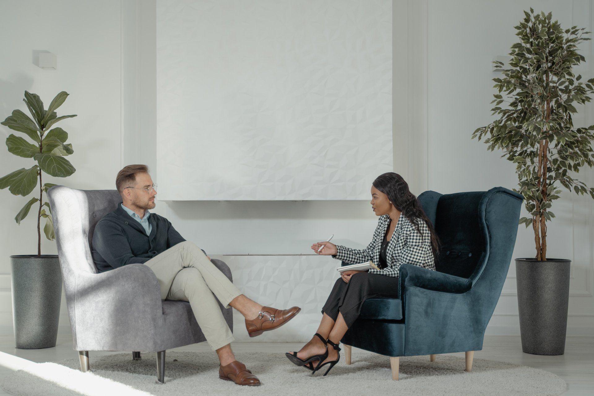 Man talking with a female psychotherapist