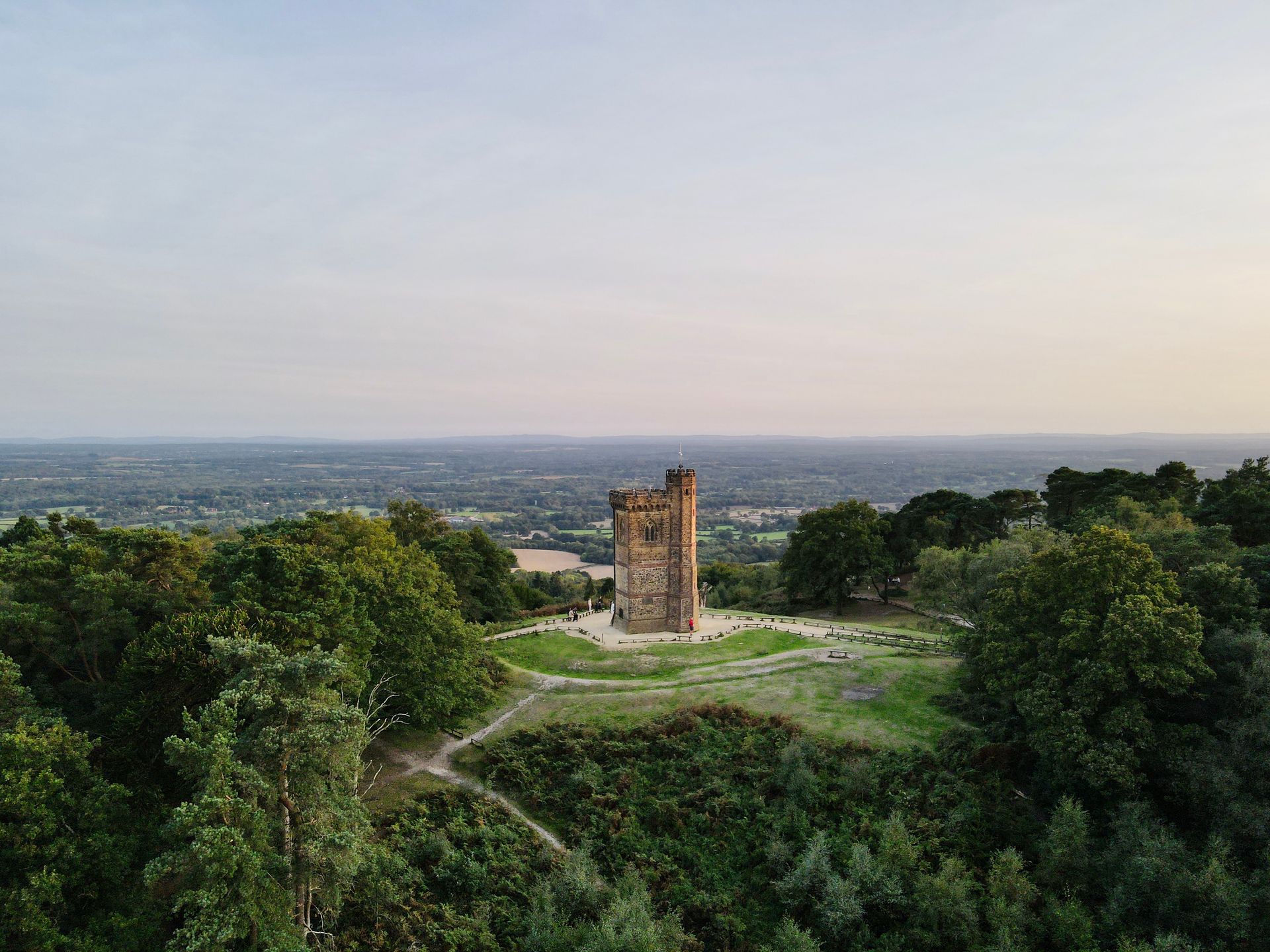an aerial view of a castle in the middle of a forest .