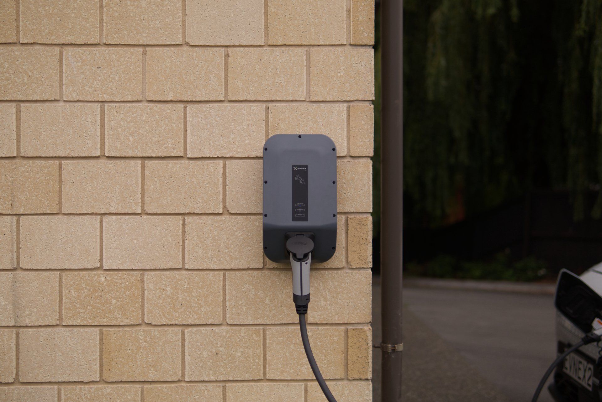 EV charger installation on exterior wall of Edmonton home