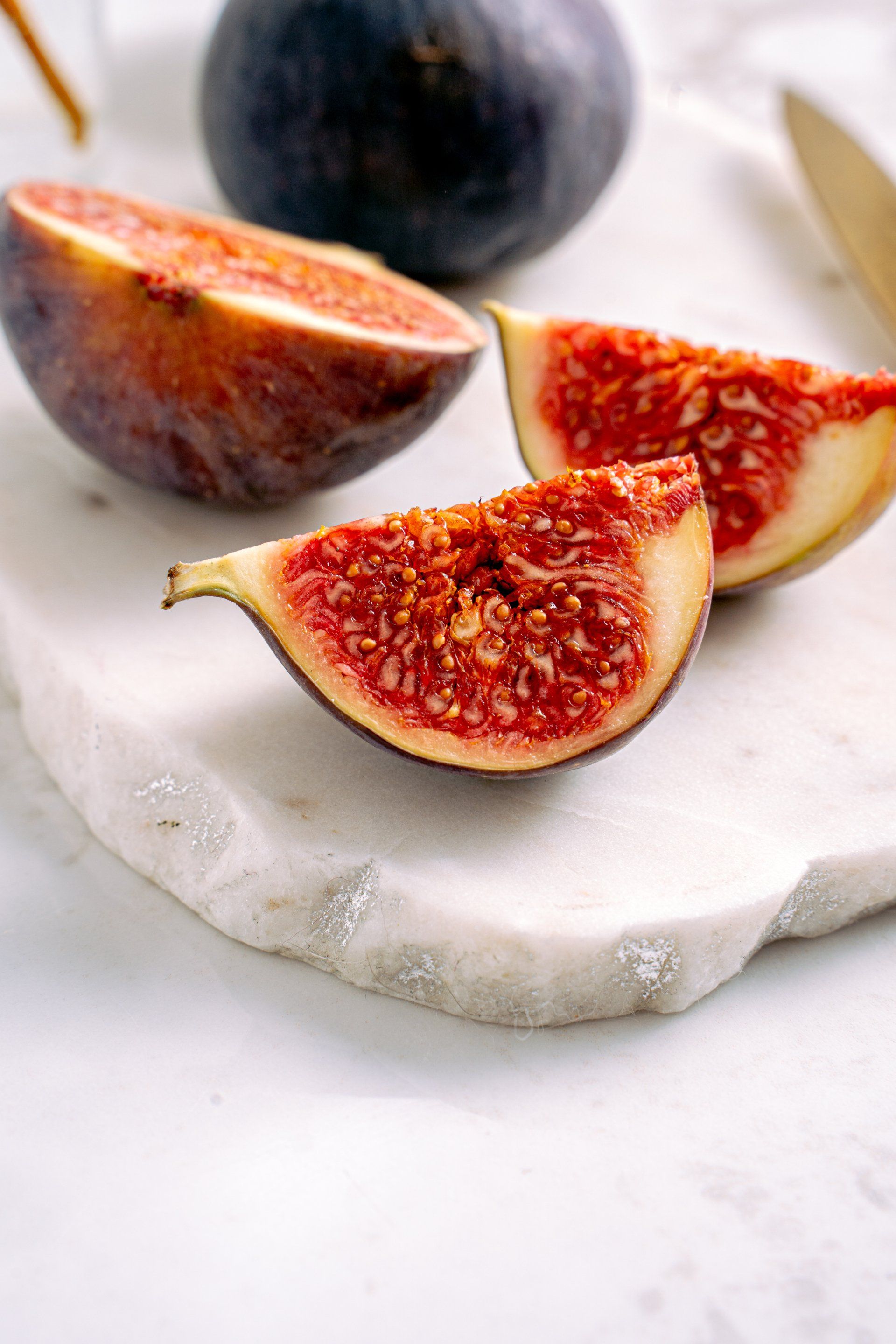 cut figs on marble tray