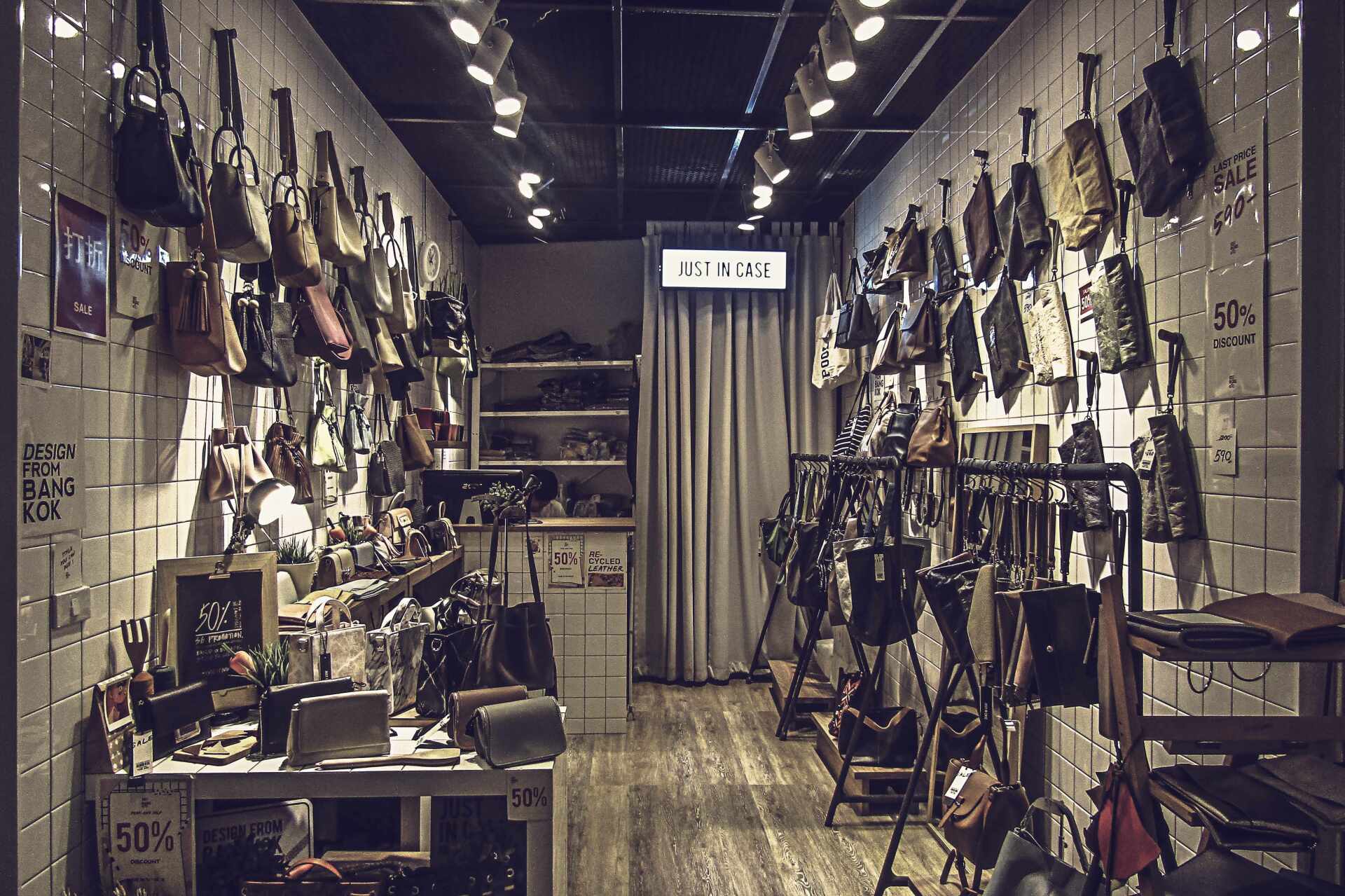 Retail boutique interior remodel with organized bag displays, updated lighting and modern finishes by ARDS Contracting in Seattle.