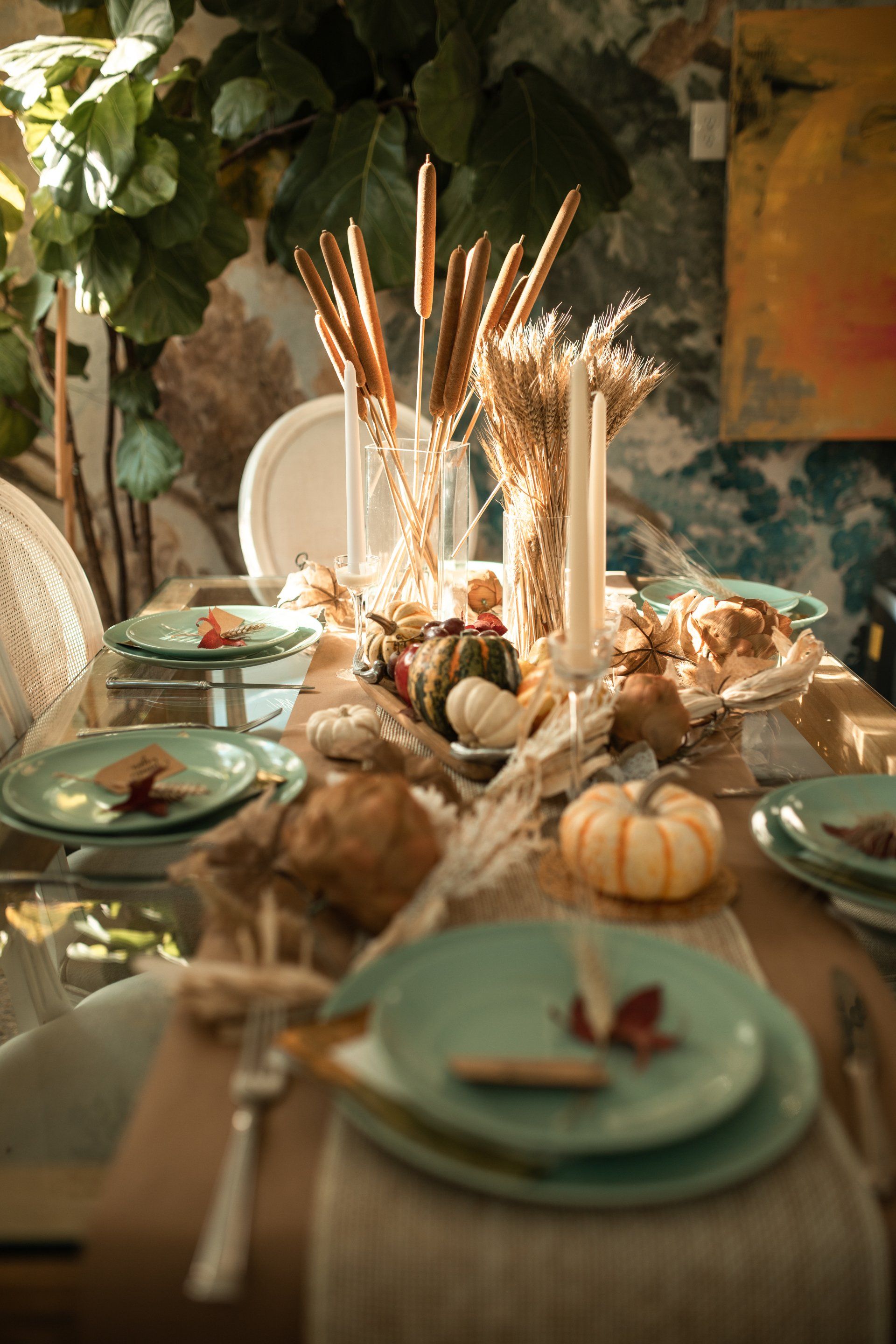 Warm holiday table decor with candles and cozy seasonal styling