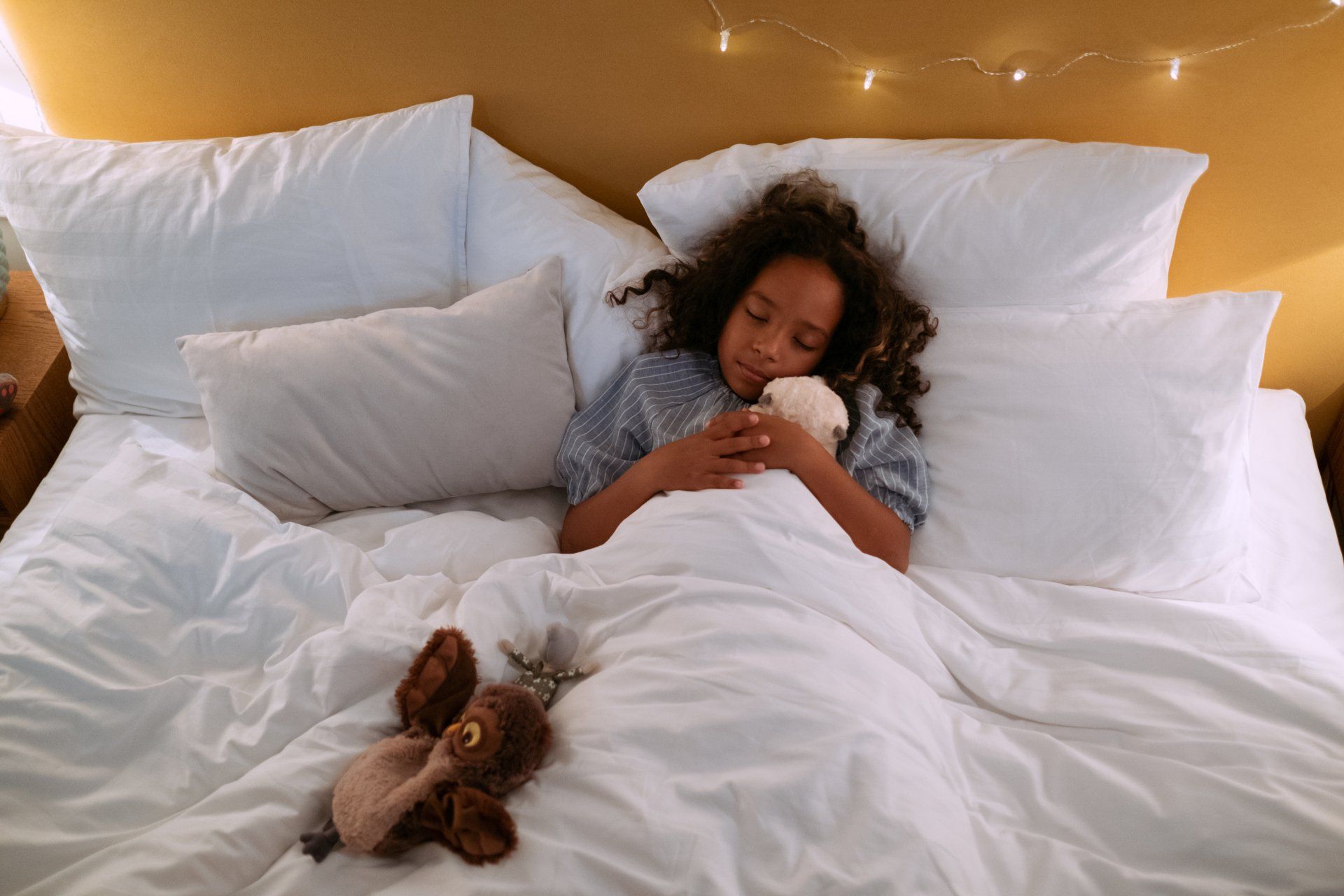 sleeping child on bed