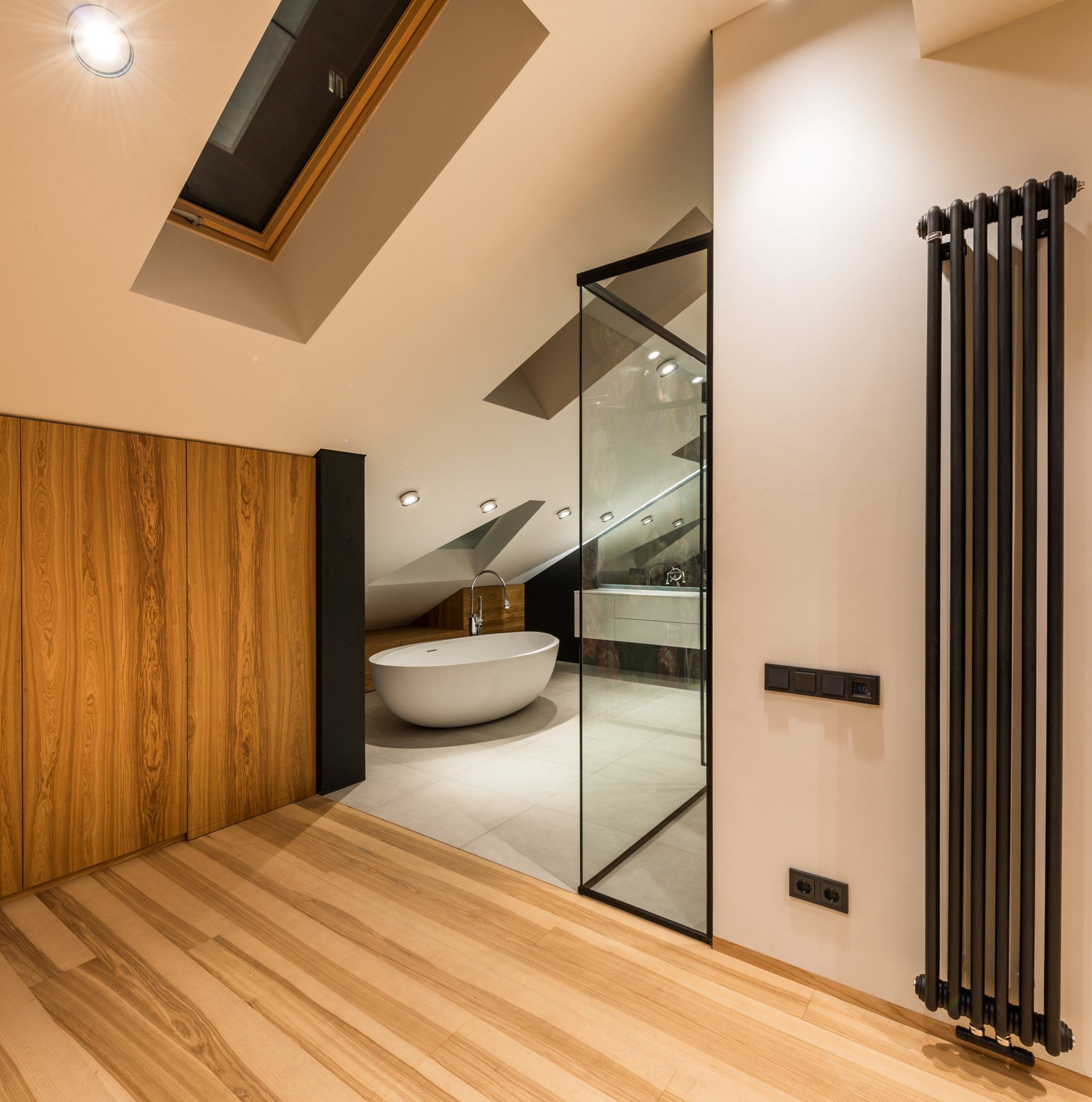 Dormer window in bathroom loft conversion, adding natural light and modern charm.
