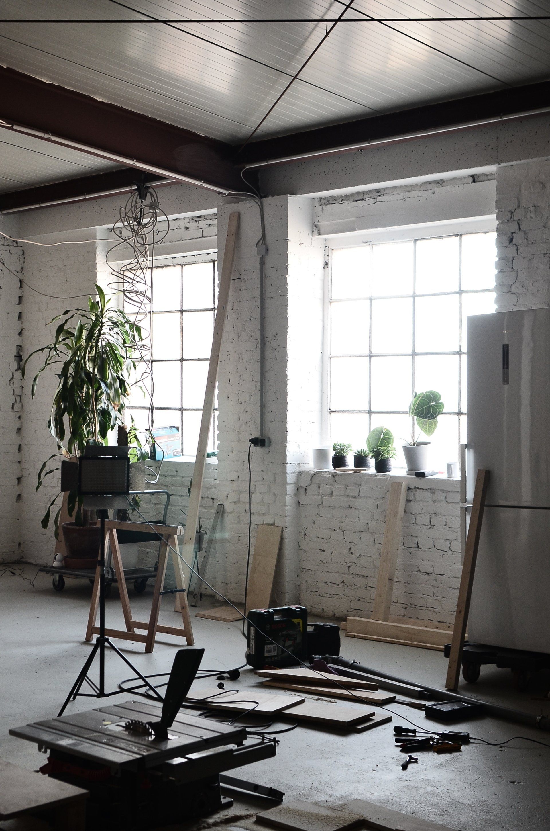 A room with a lot of furniture and a window