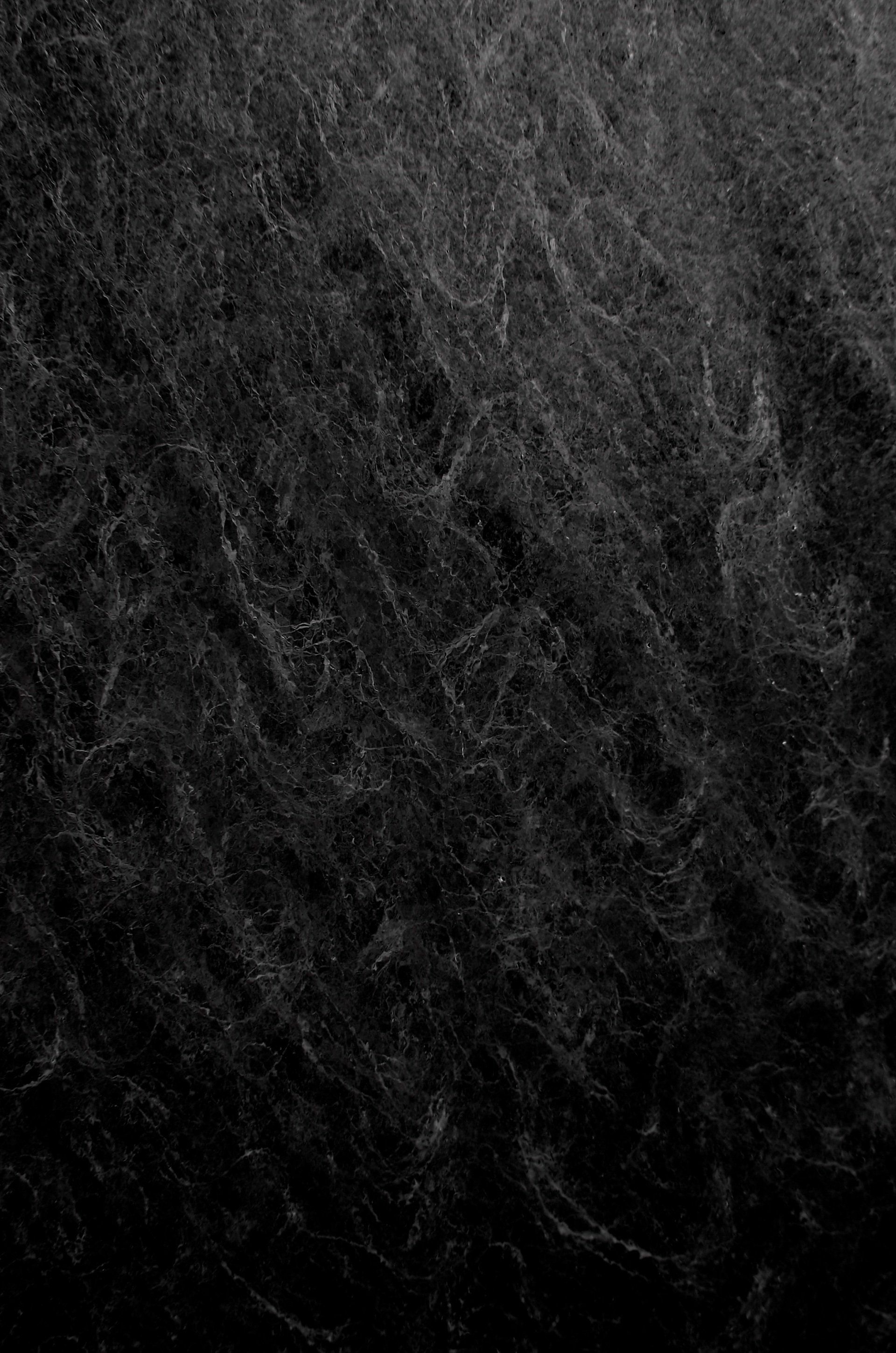 A close up of a black marble texture.
