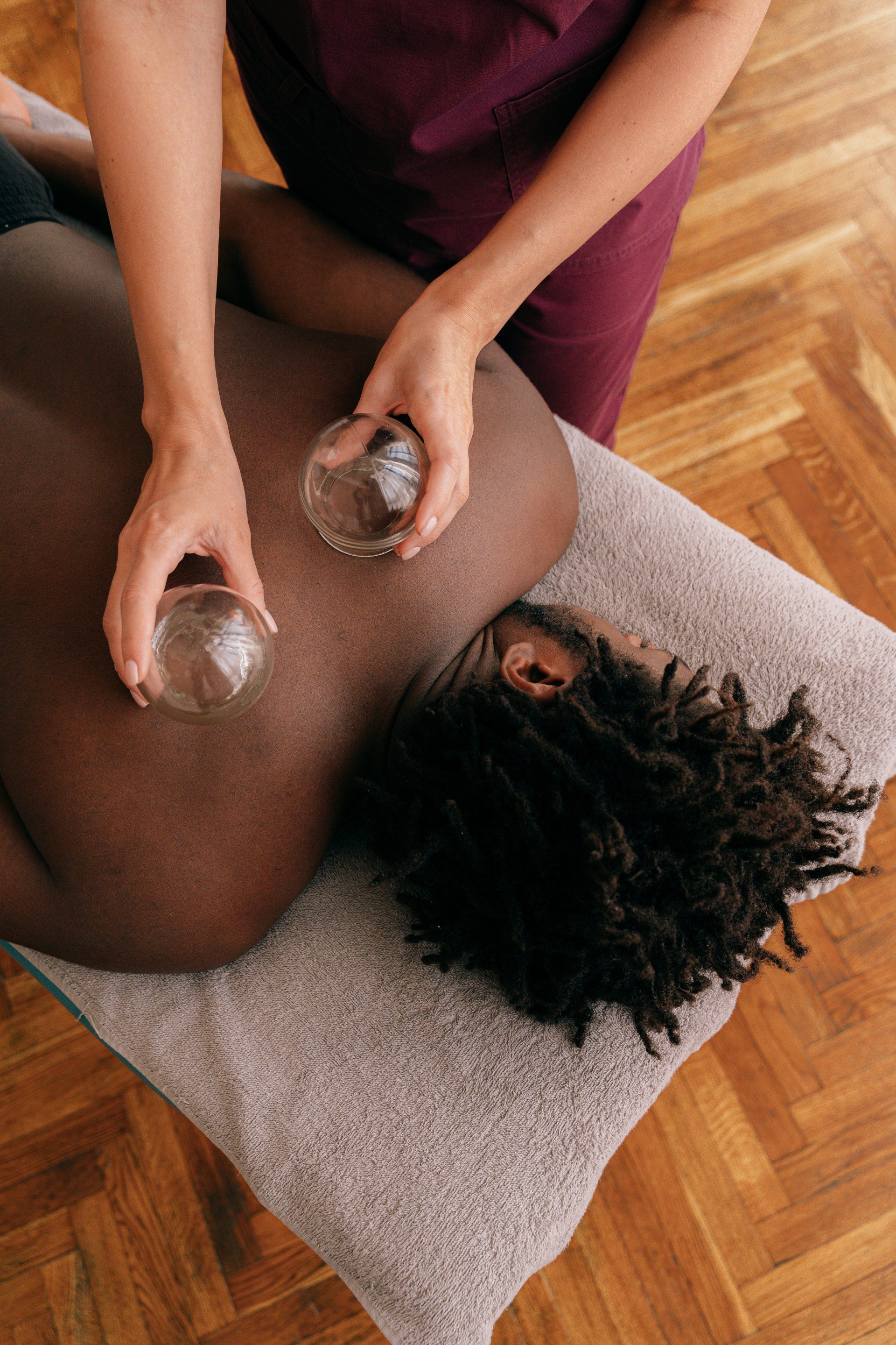 A man is getting a cupping treatment on his back.