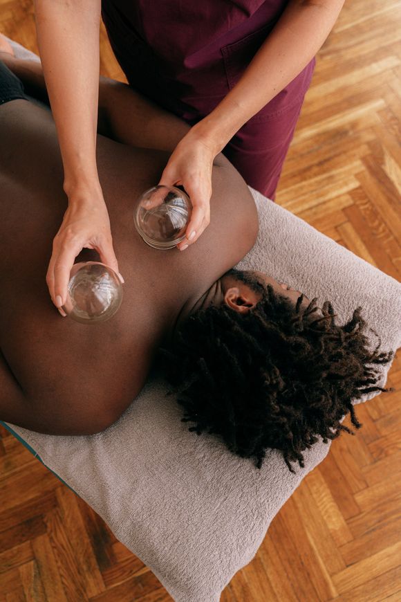 hot stone massage therapy using smooth, flat