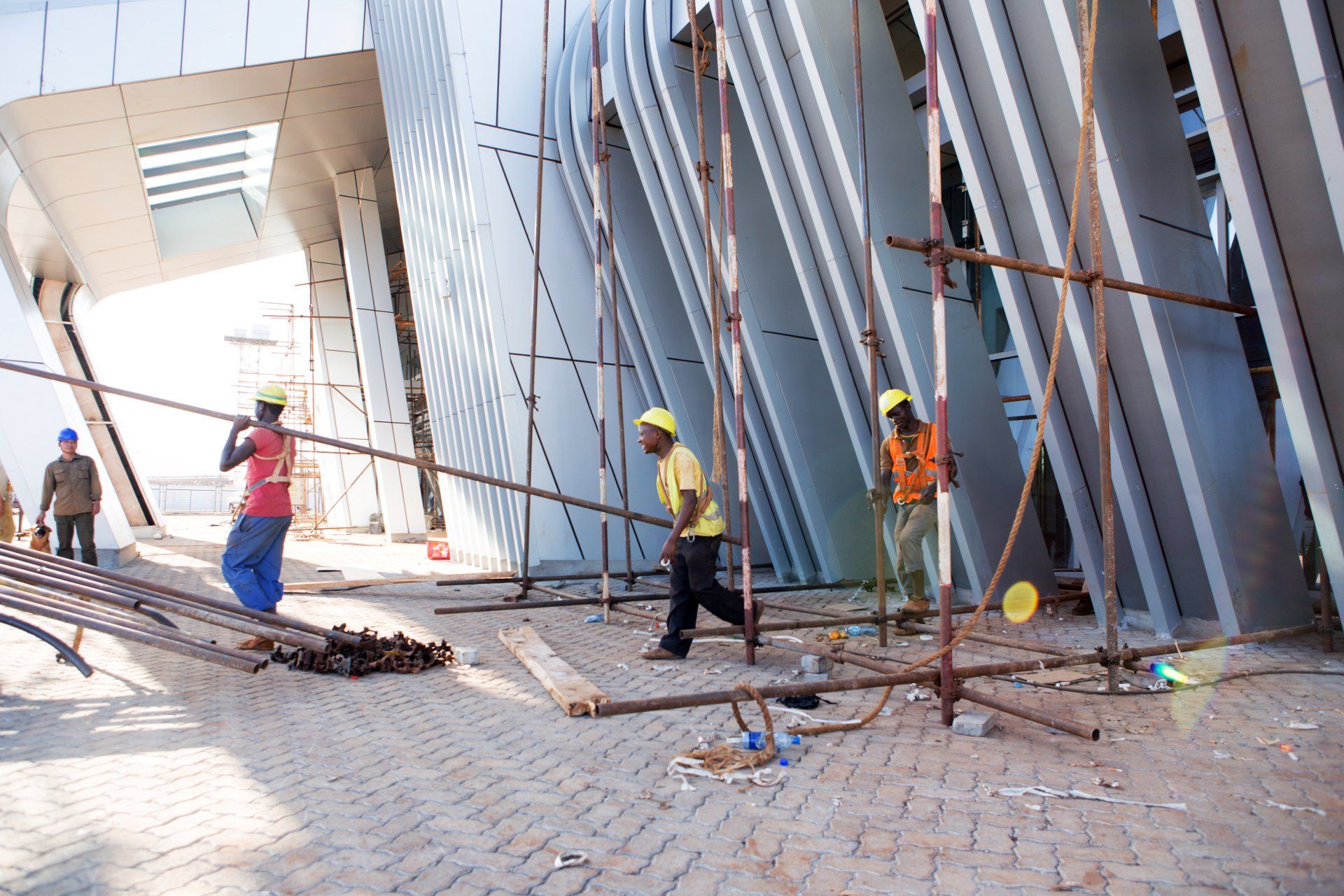 A group of construction workers are working on a building