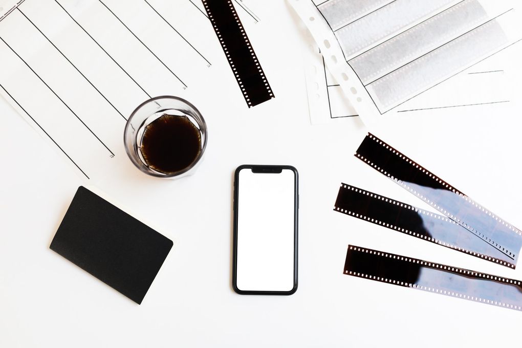 image of a phone, film, and coffee