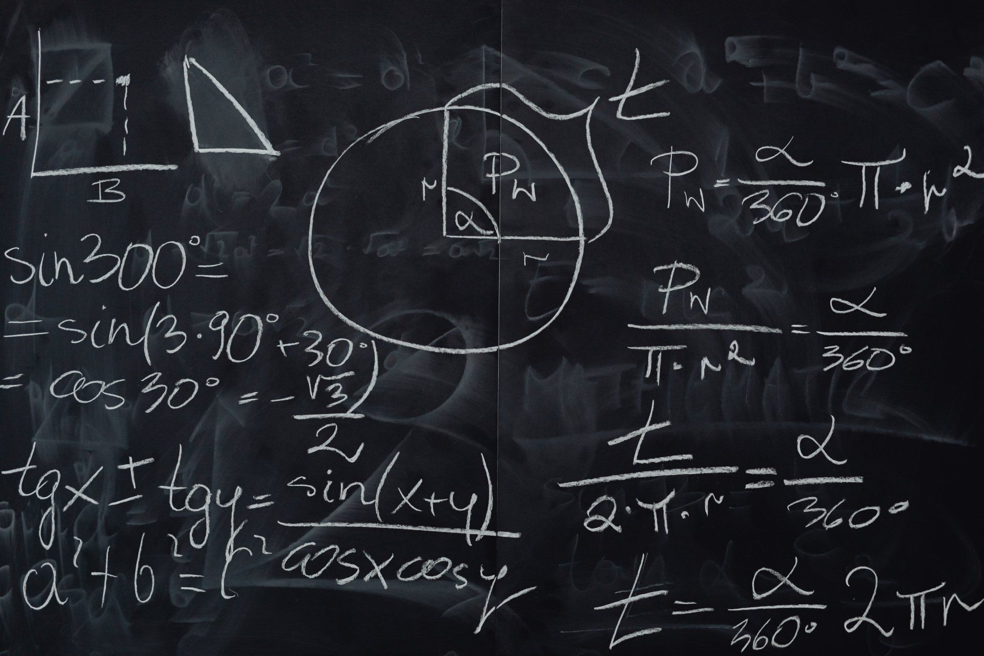A blackboard with a lot of math equations on it