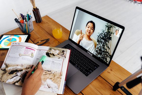 An image of a woman on a video call with a girl at Overseas Filipino Workers