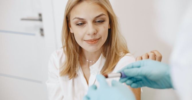 A woman is getting an injection from a doctor