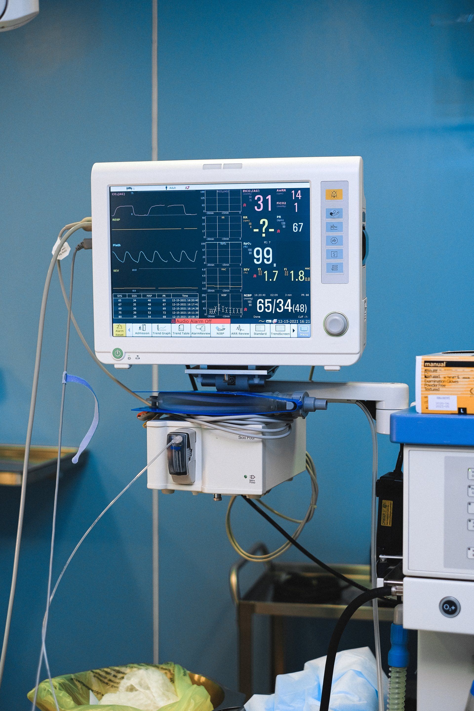 Medical monitor displaying vital signs in an operating room setting.