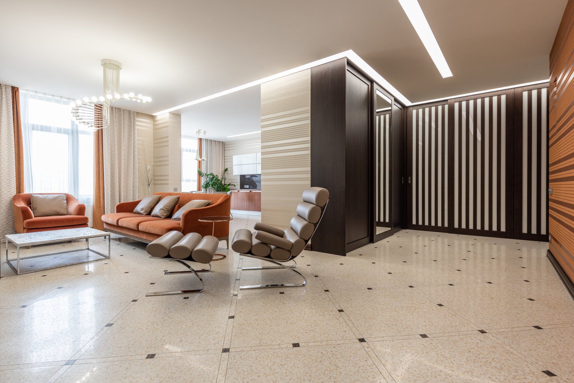 Luxury office space with neutral colored tile flooring with black accent tiles.