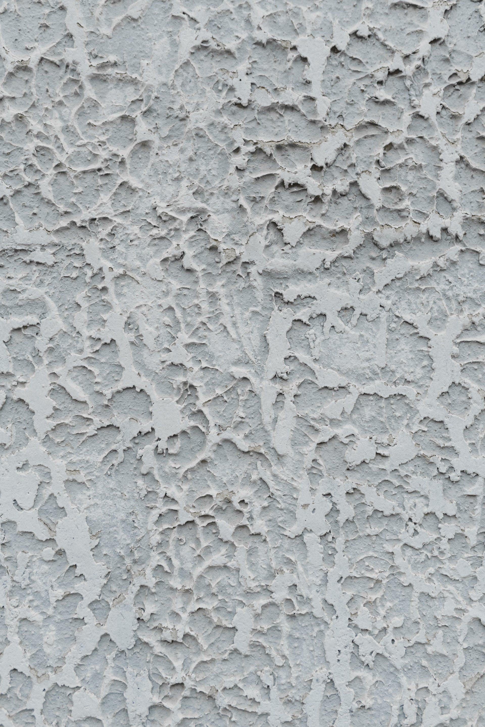 Cracked gray stucco wall