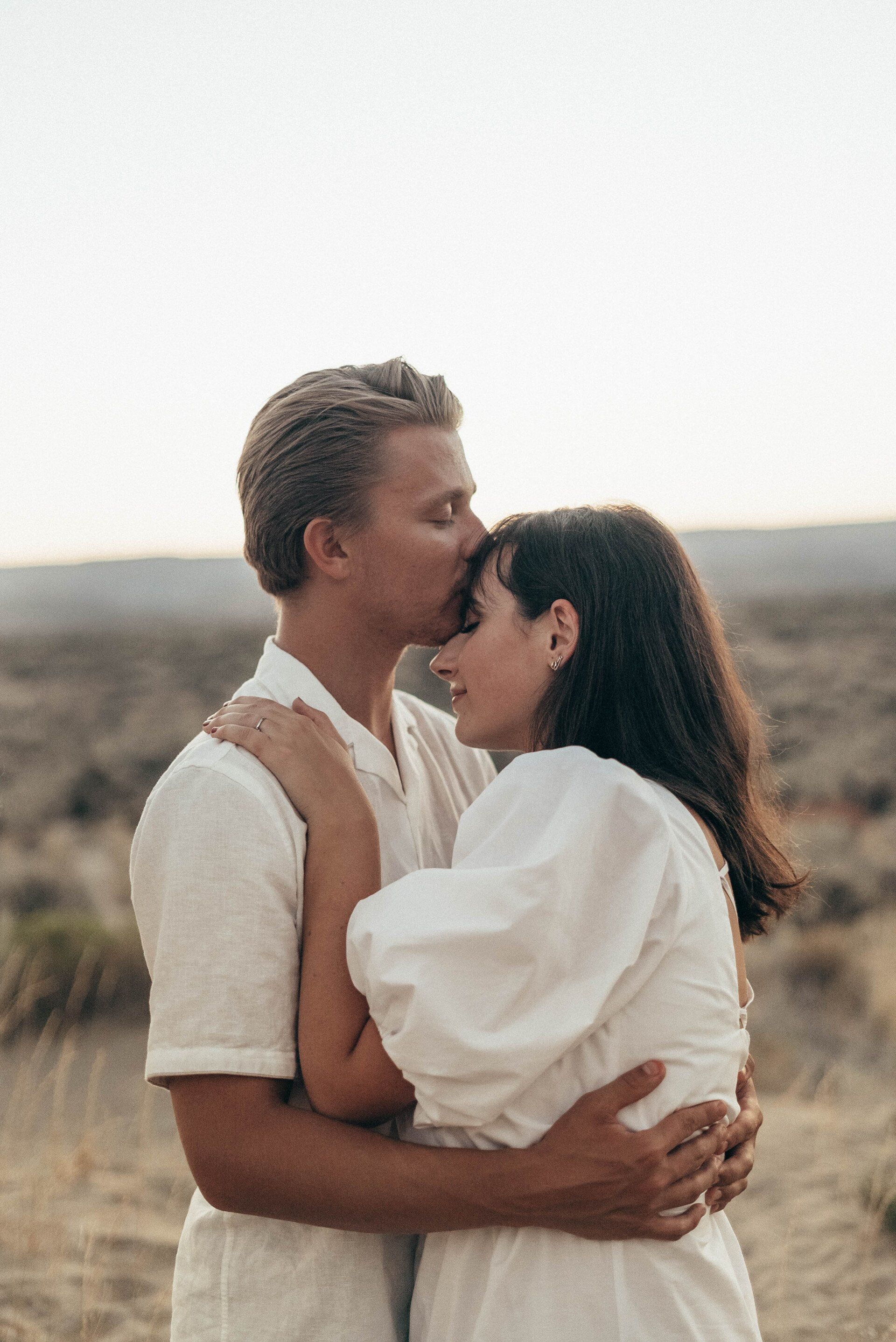 Romantic couple embracing after a successful match in Reno.