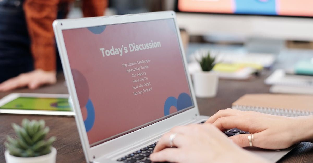 Person typing on laptop showing