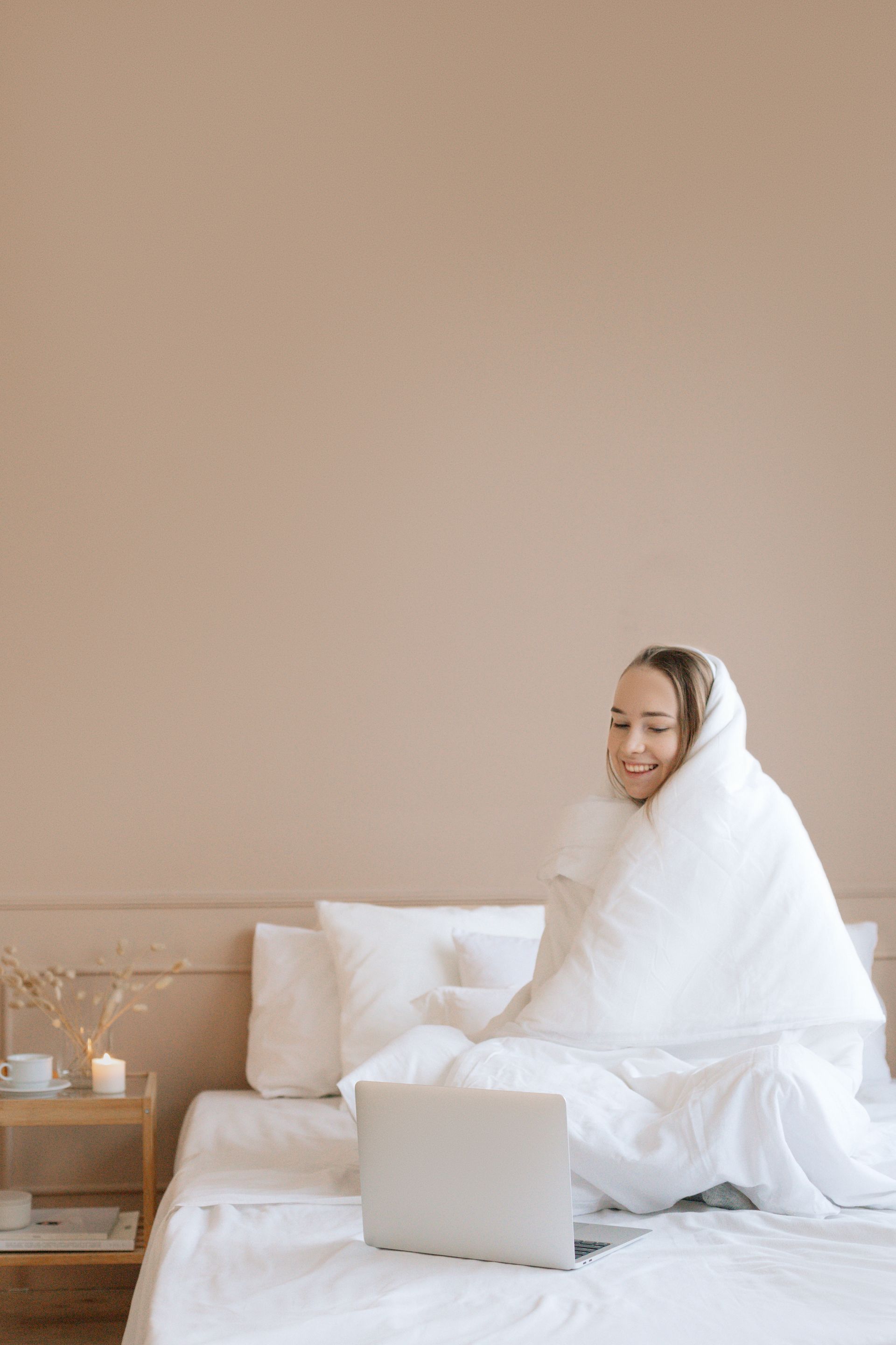 a woman covered with a blanket