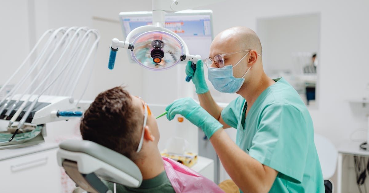 doctor checking patients mouth