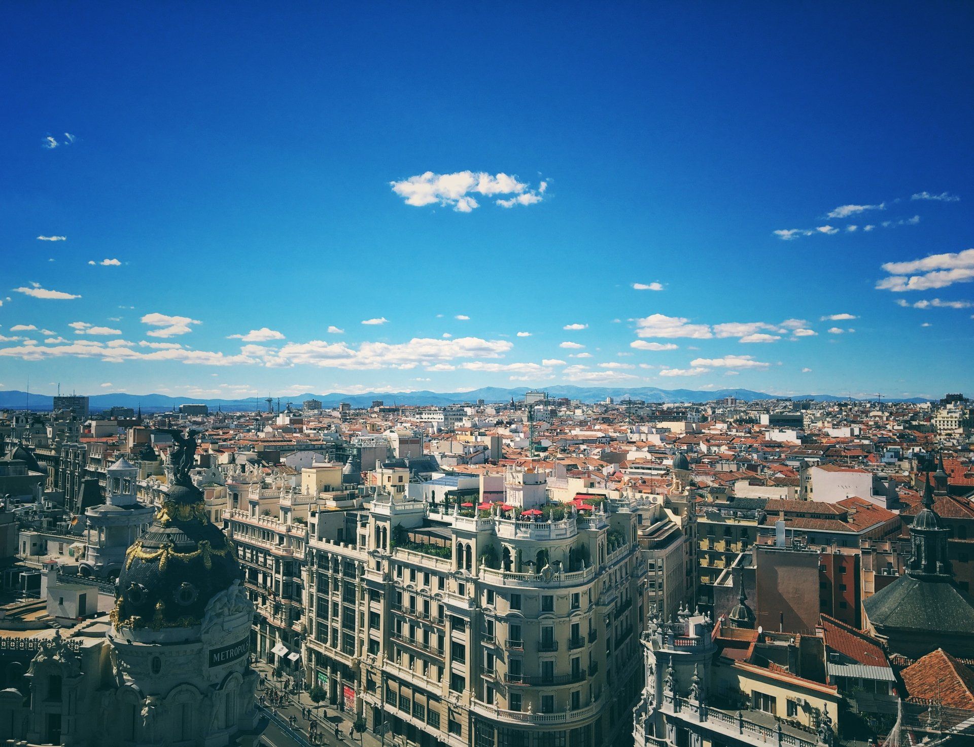 An aerial view of a city on a sunny day