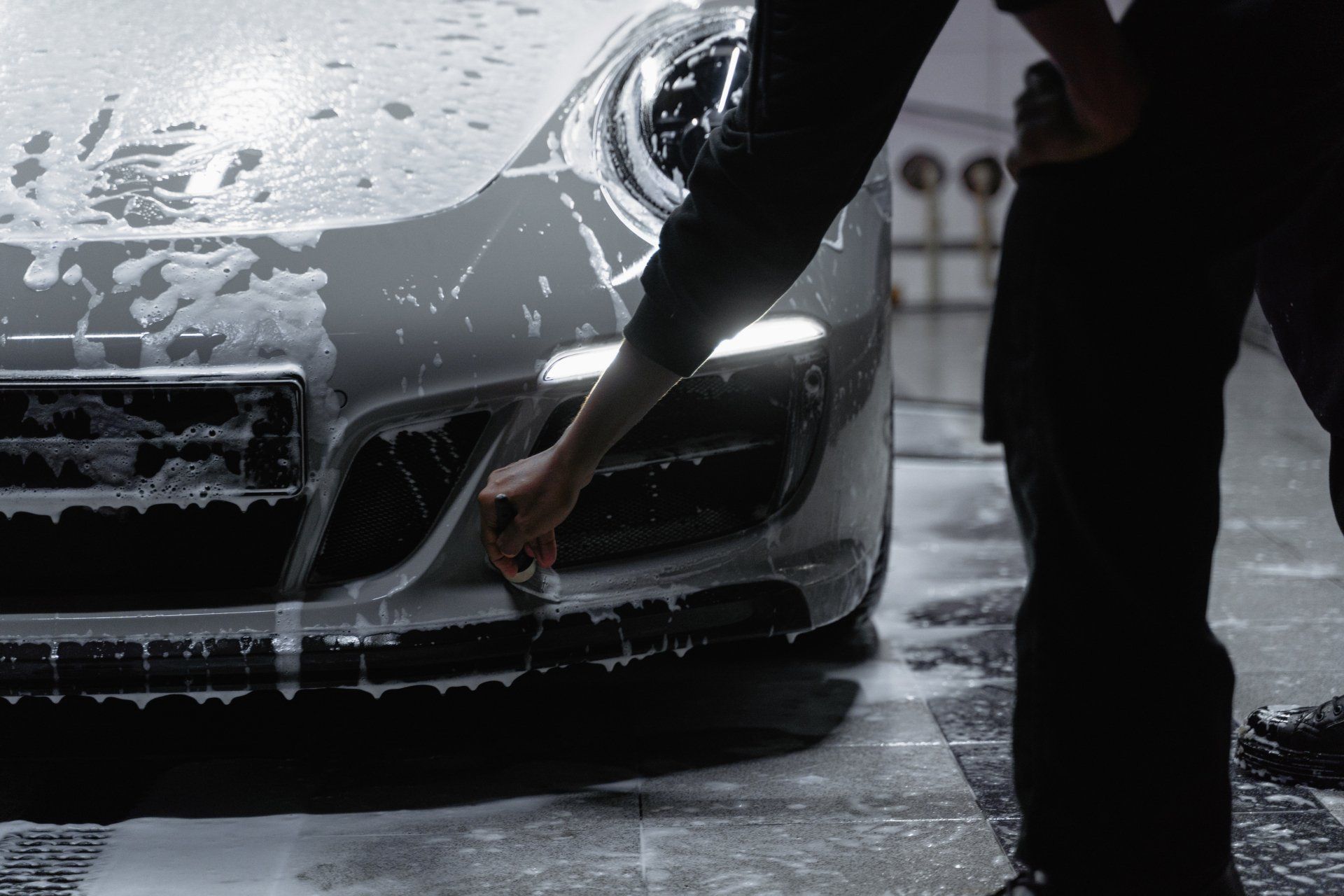 Keptcar team hand washing a luxury vehicle in Albany