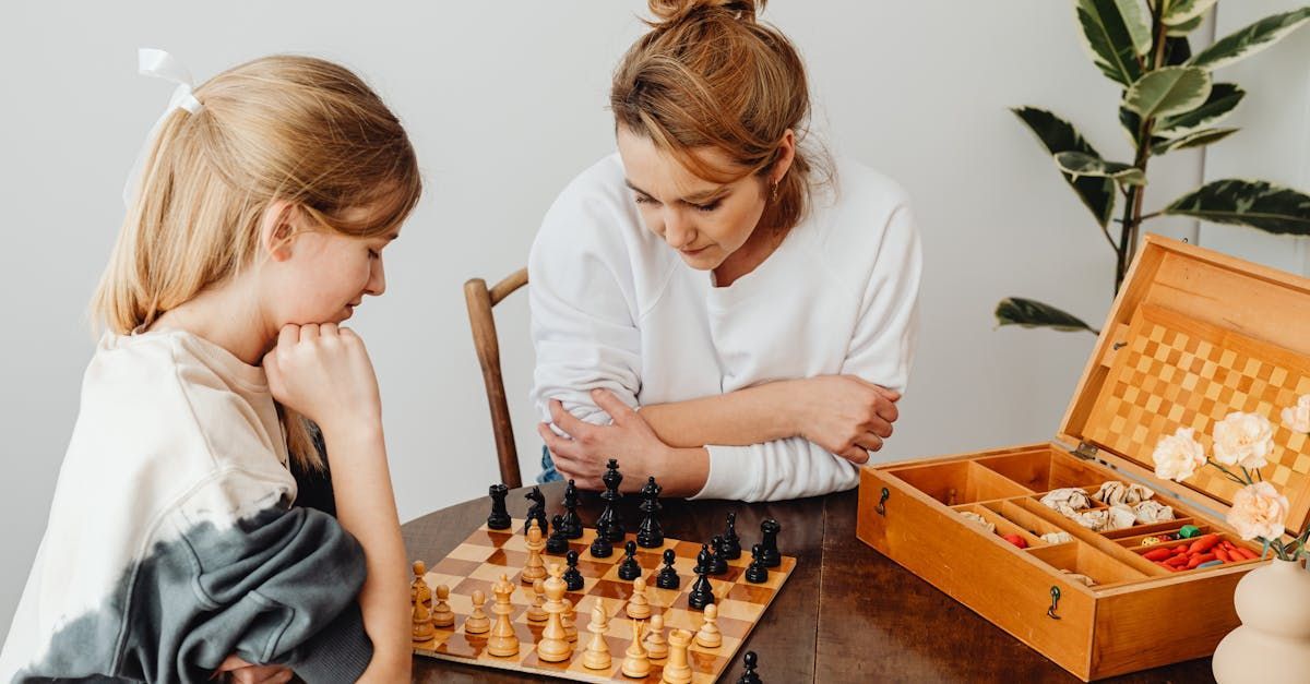 NDIS accomodation in Gungahlin - A woman and a little girl are playing chess at a table.
