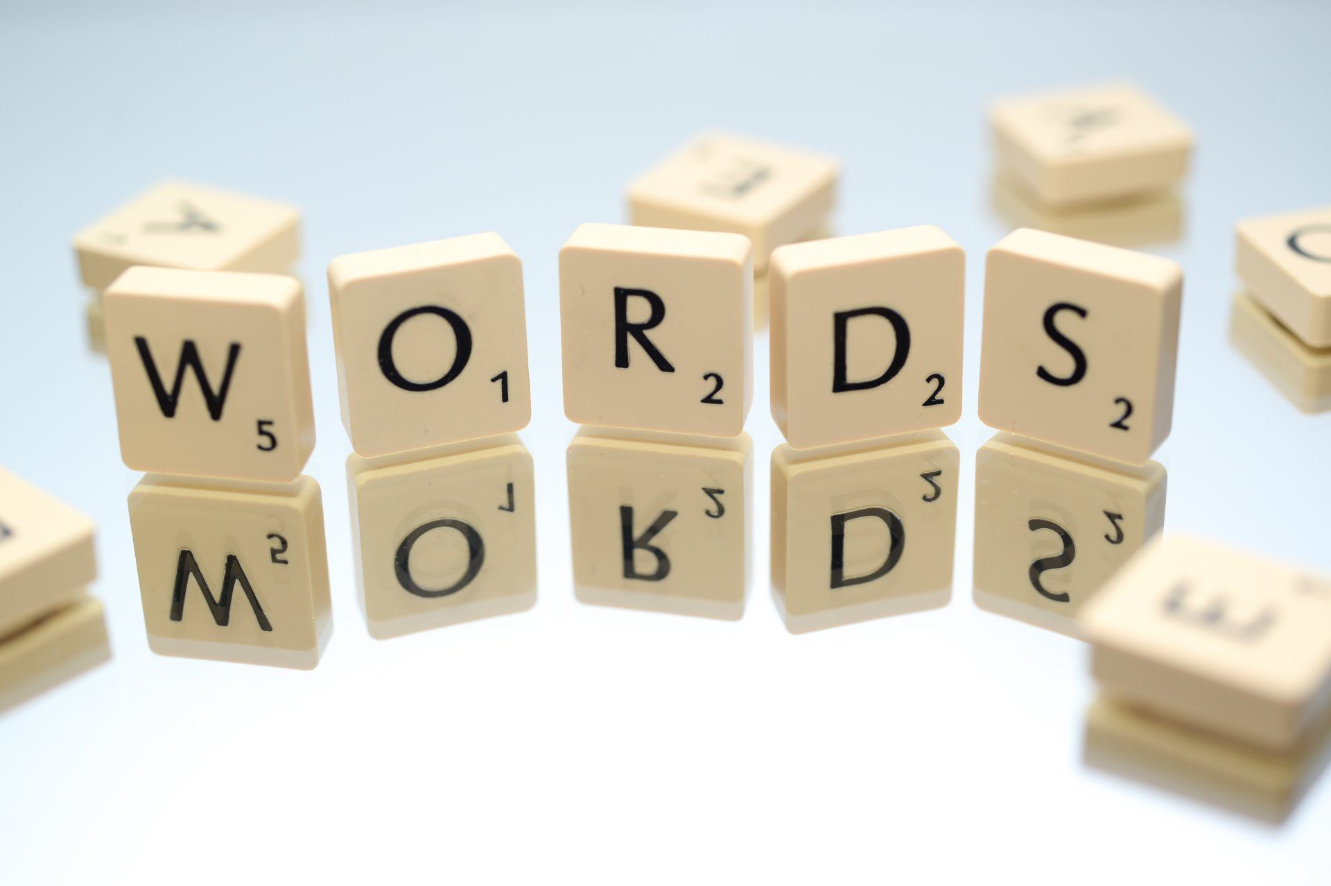 Scrabble tiles with the word words written on them