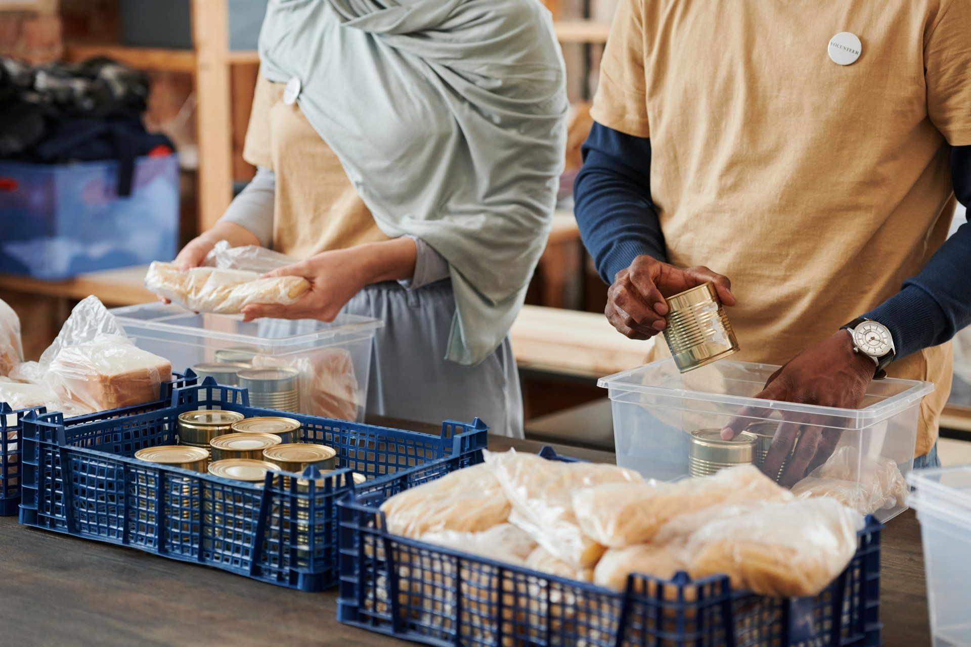 People place canned food in plastic bins