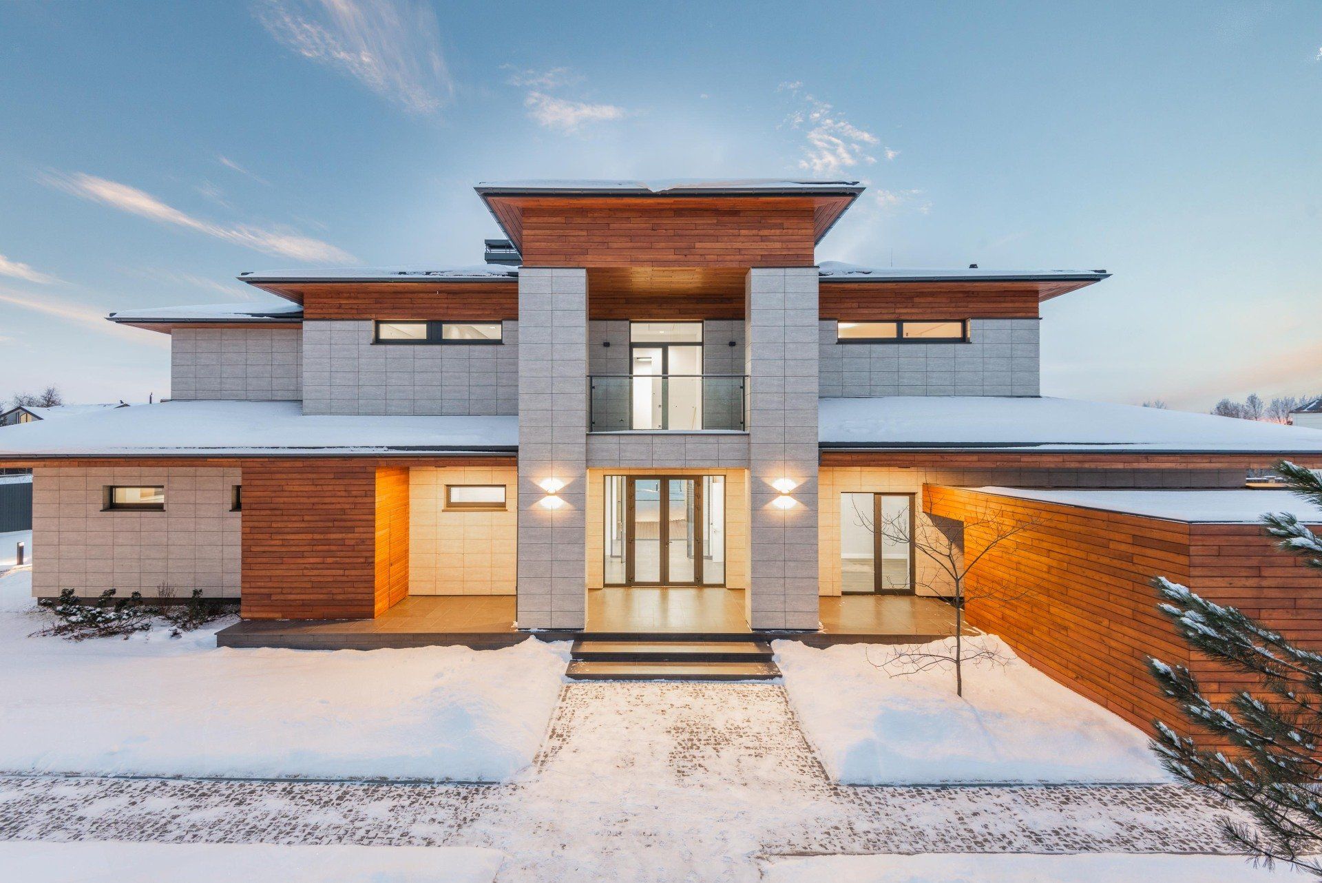 the front of a house with snow on the ground - new custom home constructed by Compass Construction Services