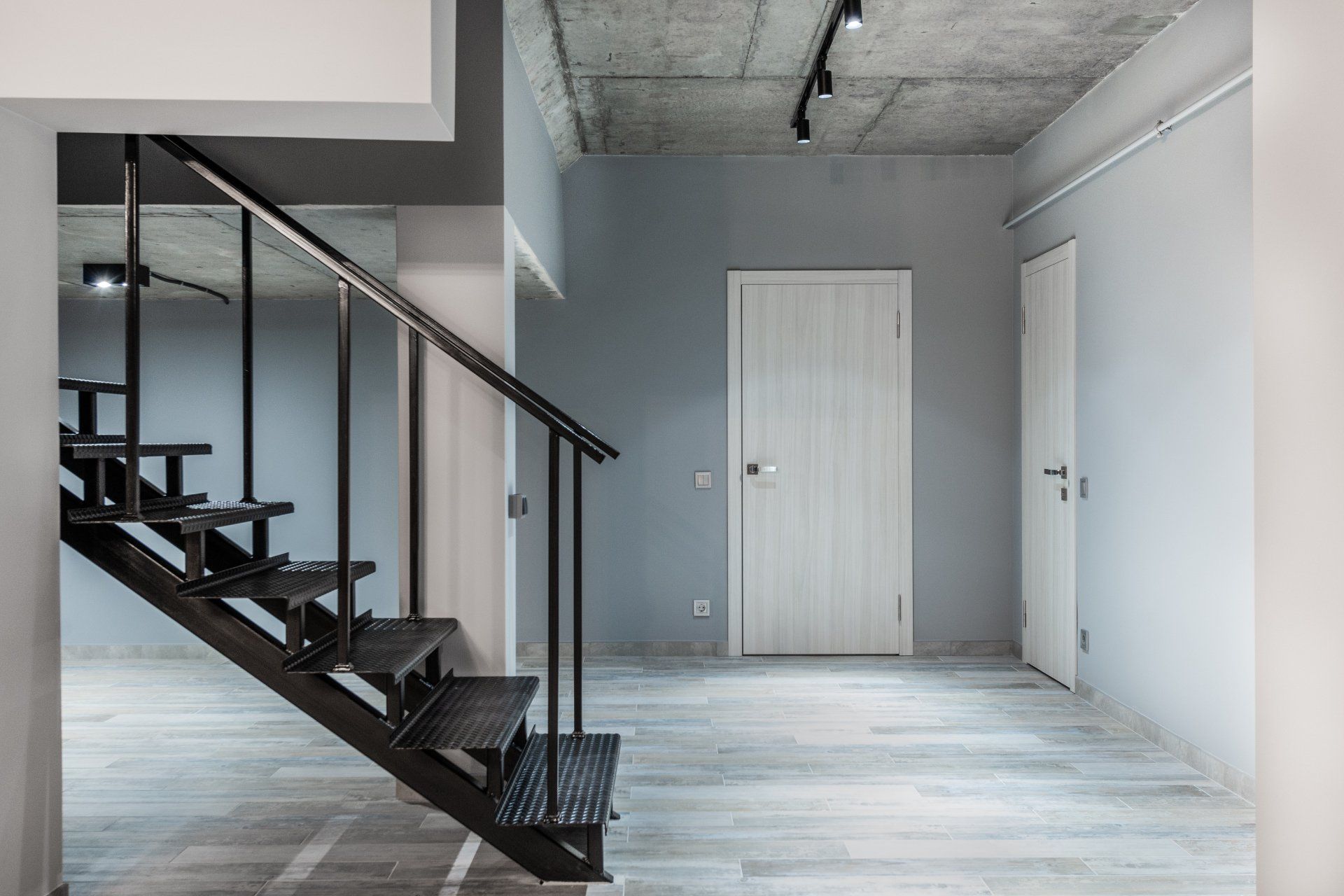 staircase with handrails in an empty room