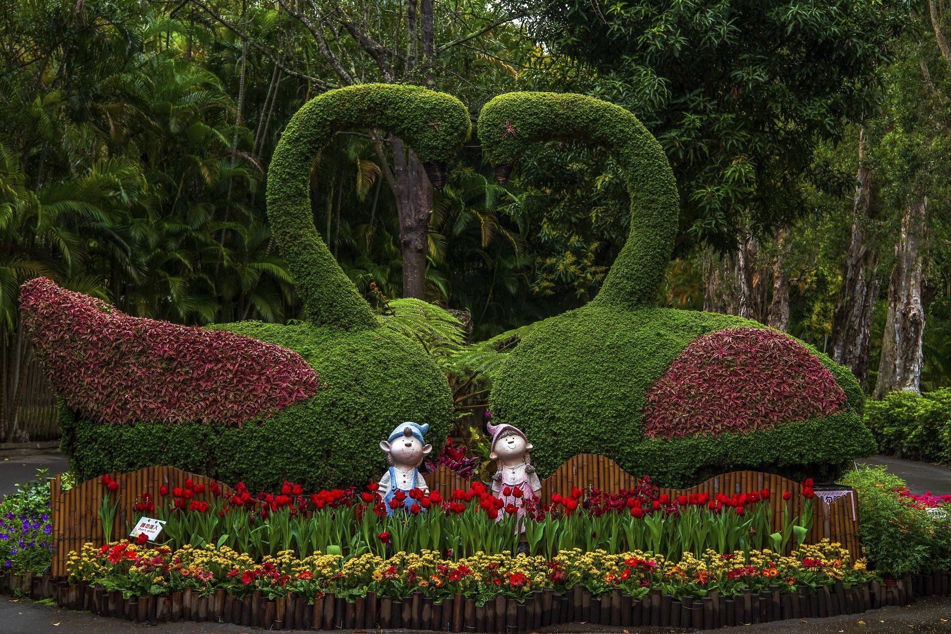 good that is made from grass with gnomes and flowers in the front