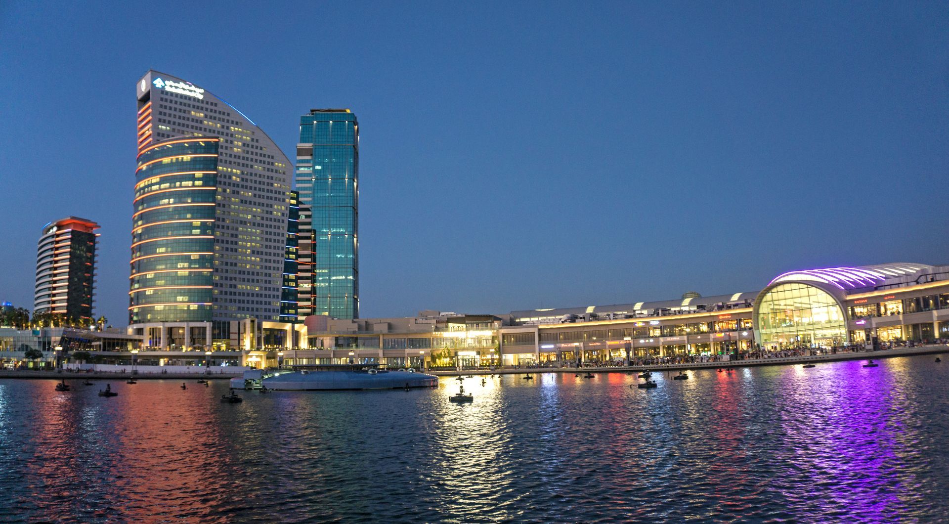 A large body of water with a city in the background