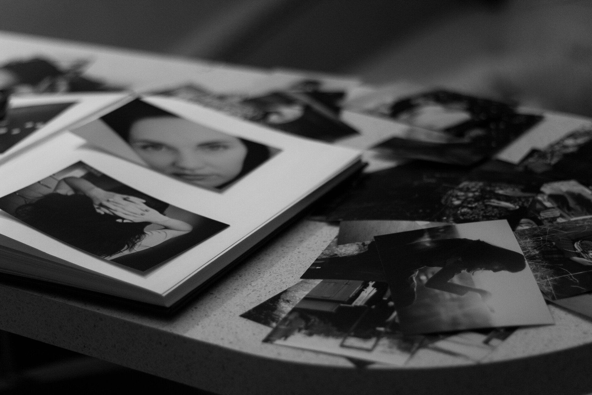 A black and white photo album on a table
