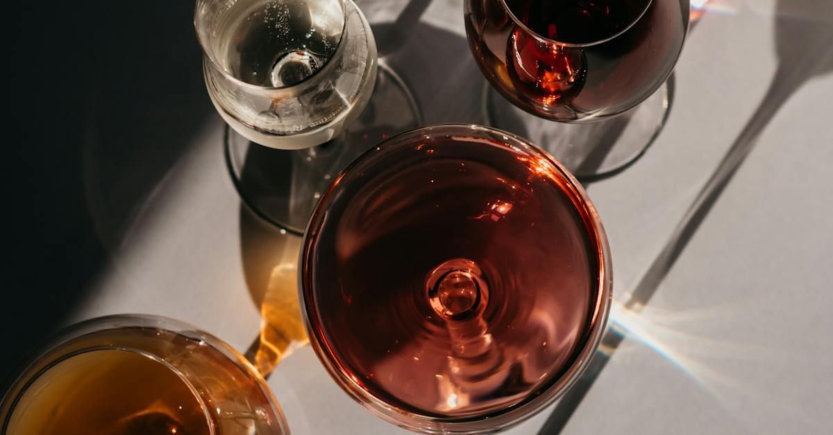 a row of wine glasses are lined up on a table .