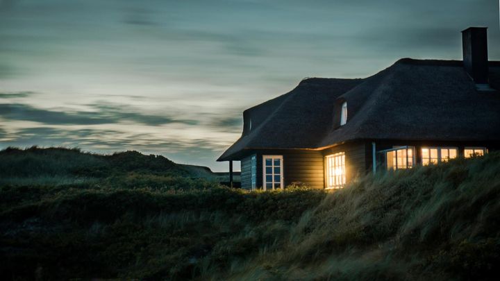 A house with light shining through, highlighting the need for foundation repair near me and reliable house foundation repair.