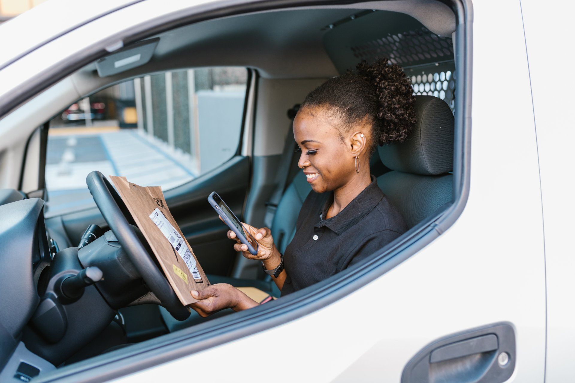 Woman as driver on a phone