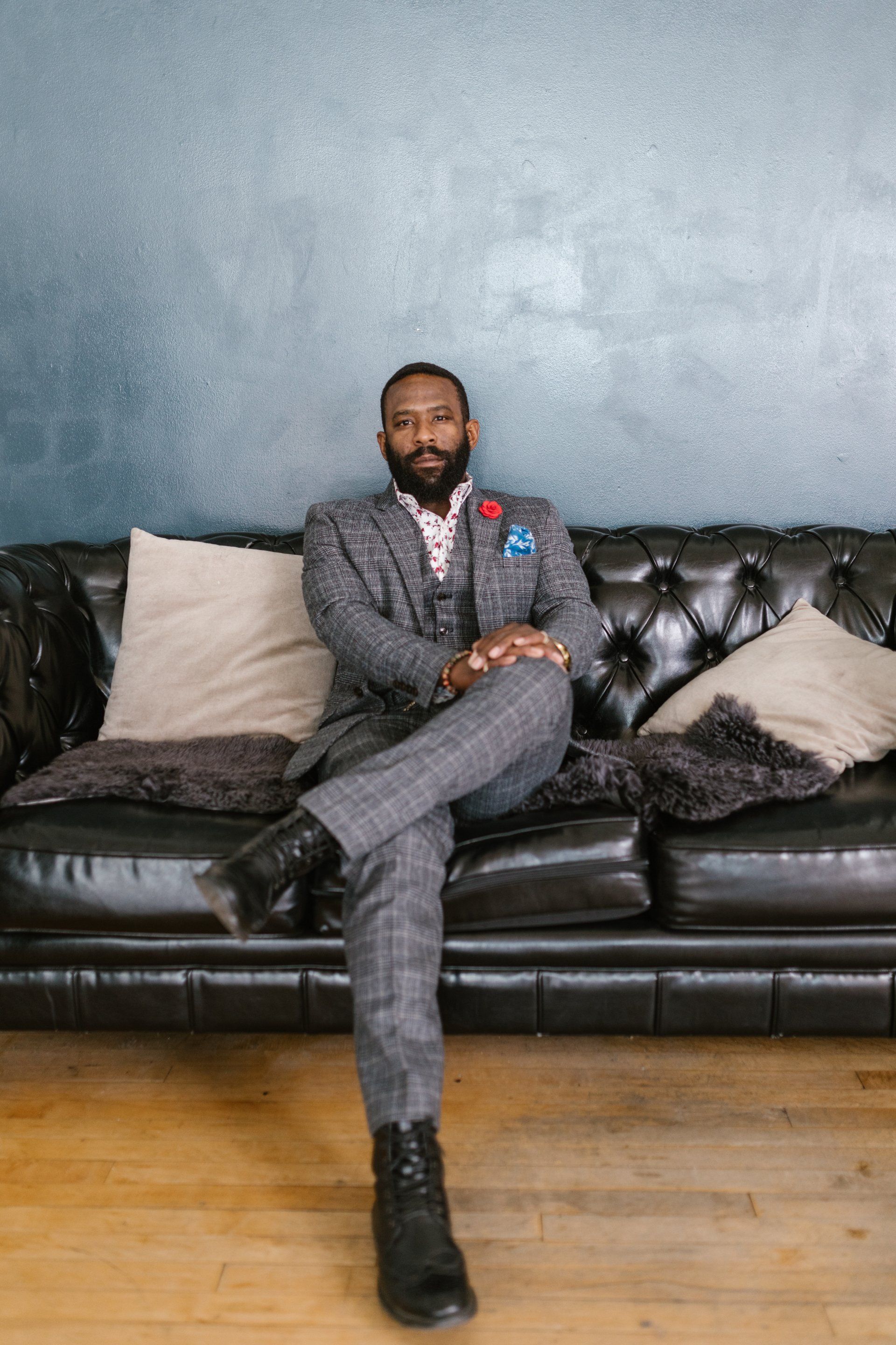 Man on sofa in grey suit - HR Consultancy Services