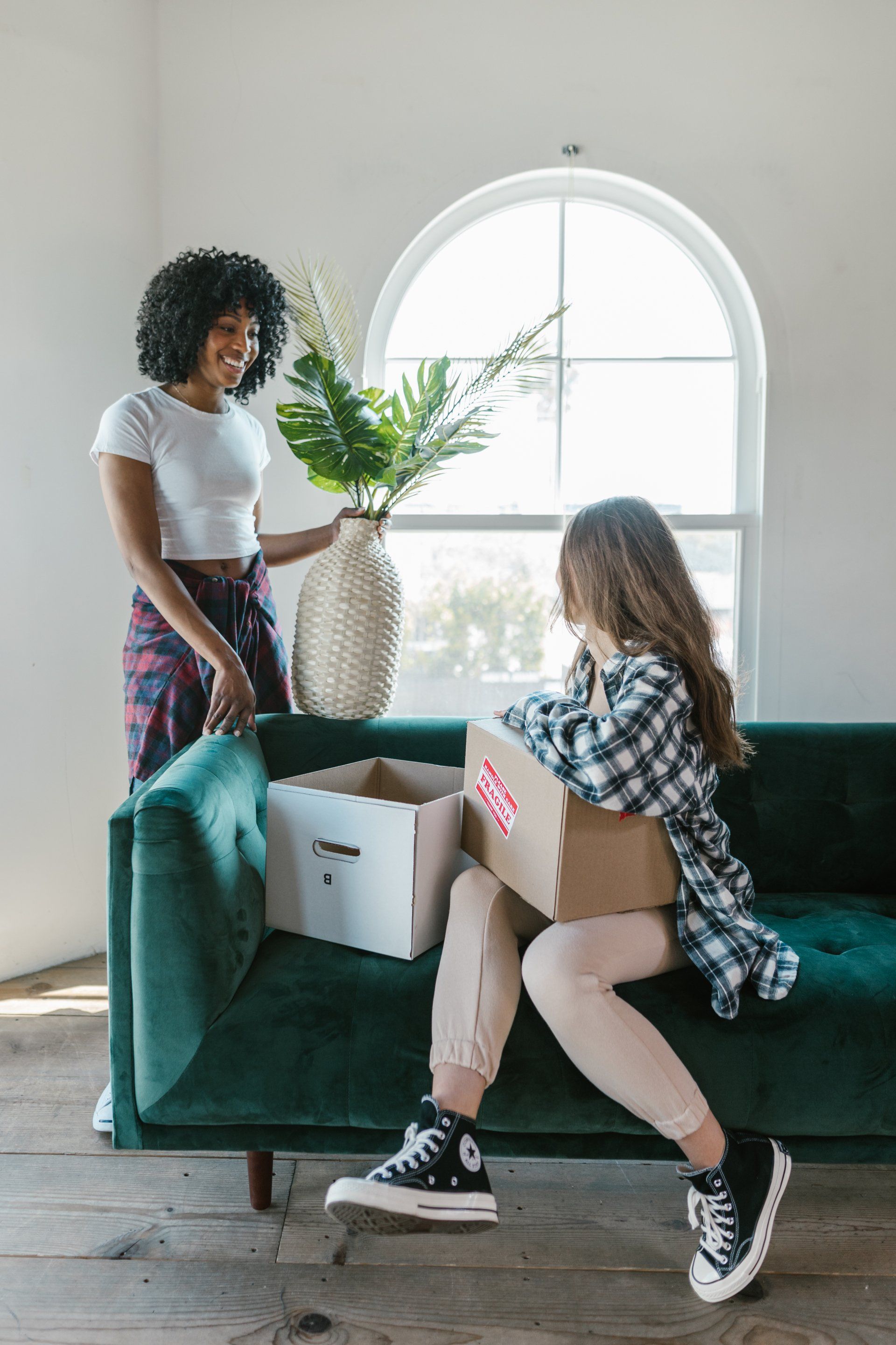 two people pack an apartment