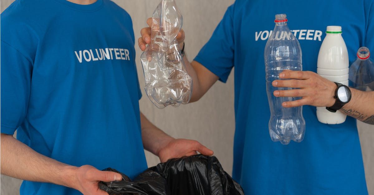 Volunteers sorting recyclable plastic bottles
